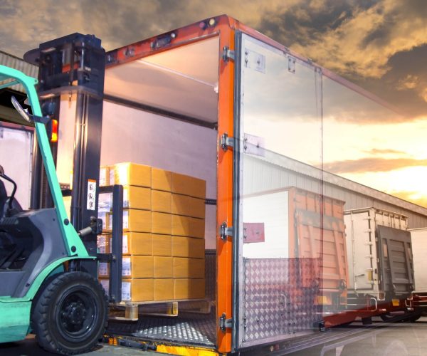 Double exposure of forklift loading shipment goods pallet into the truck container, freight industry warehouse , logistics and transport